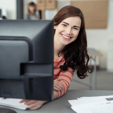 student in front of computer monitor