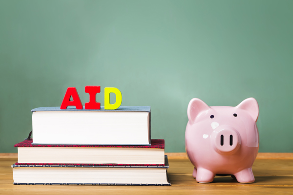 piggy bank next to books